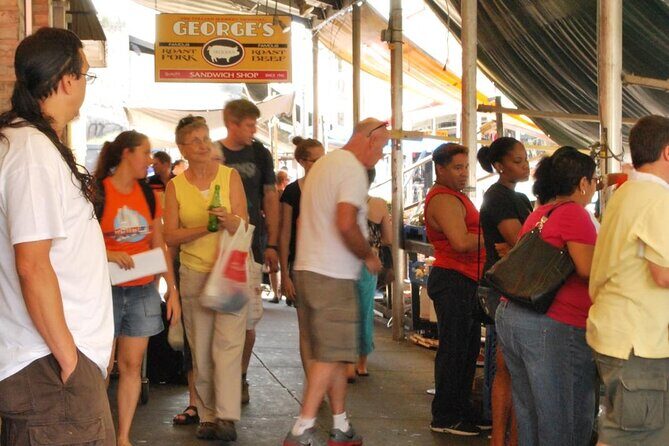 Philly Italian Market Walking Tour Geno's - The Final Touch: Cheesesteak Rivalry