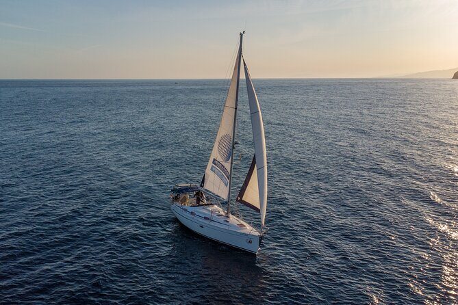 Sailing at sunset along the cliffs of Maro-Compartida - Authentic Experiences and Authenticity