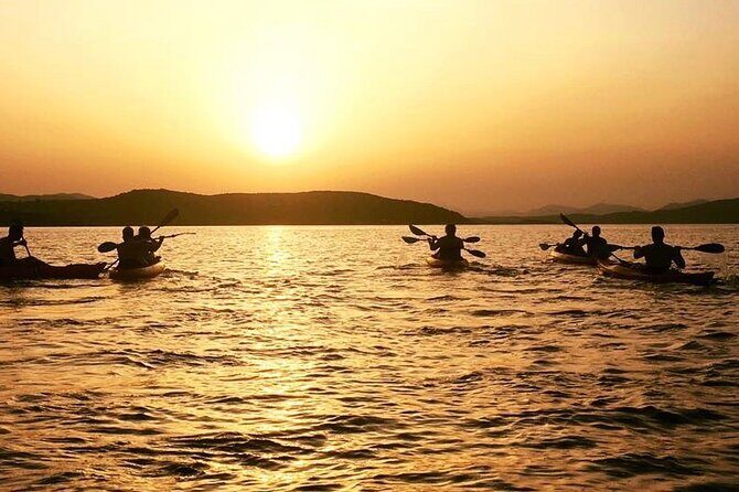 Sunset Kayak Tour with Snorkeling and Local Aperitif - Key Points