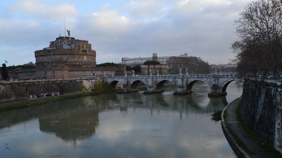 Castel Sant Angelo and bridge reflected in the Tiber