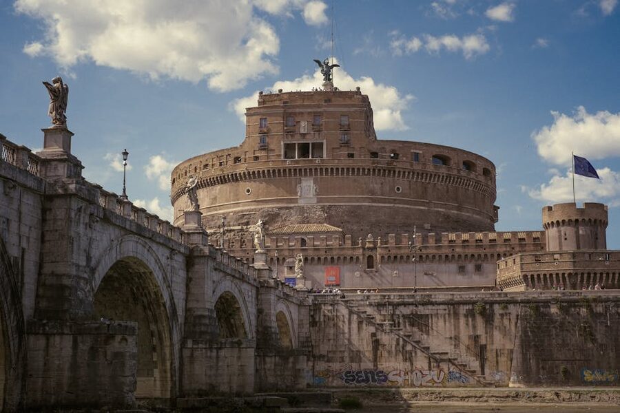 Angel statue on bridge with Castel Sant Angelo behind