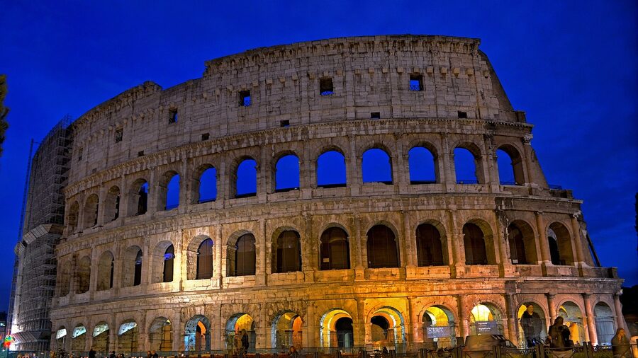 The Colosseum illuminated at night in Rome