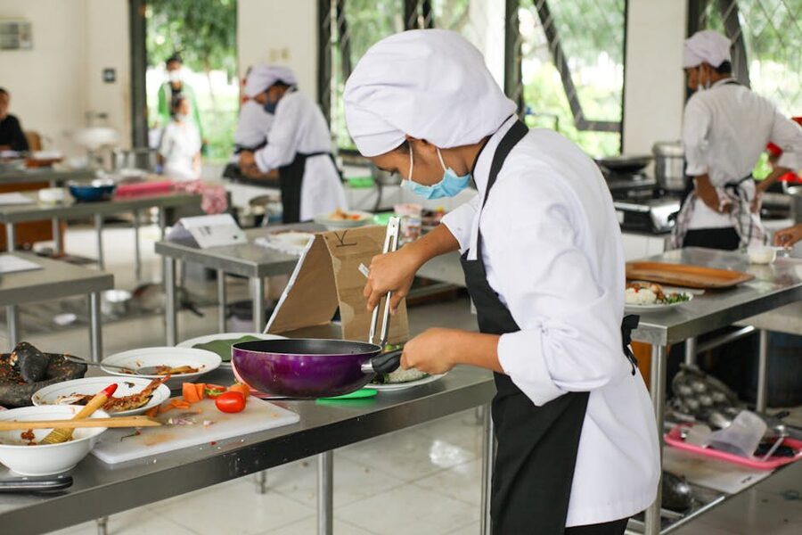 Culinary students practicing cooking in a class
