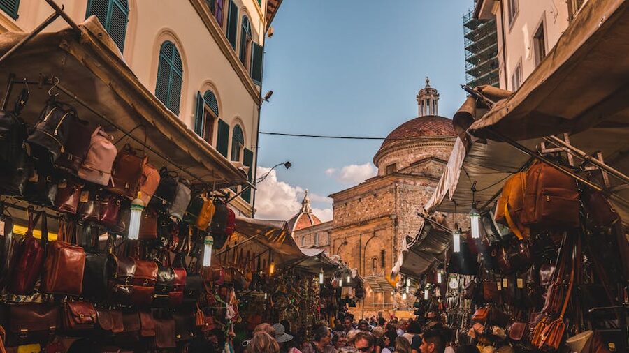Florence street market with basilica visible in background