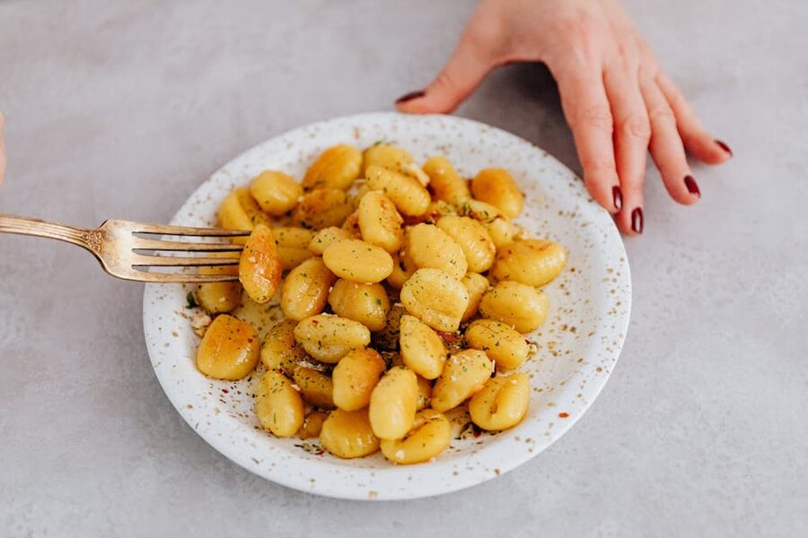Fresh gnocchi served on a ceramic plate