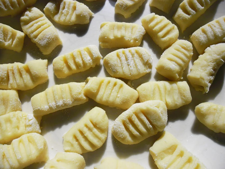 Fresh homemade gnocchi on a flour-dusted surface