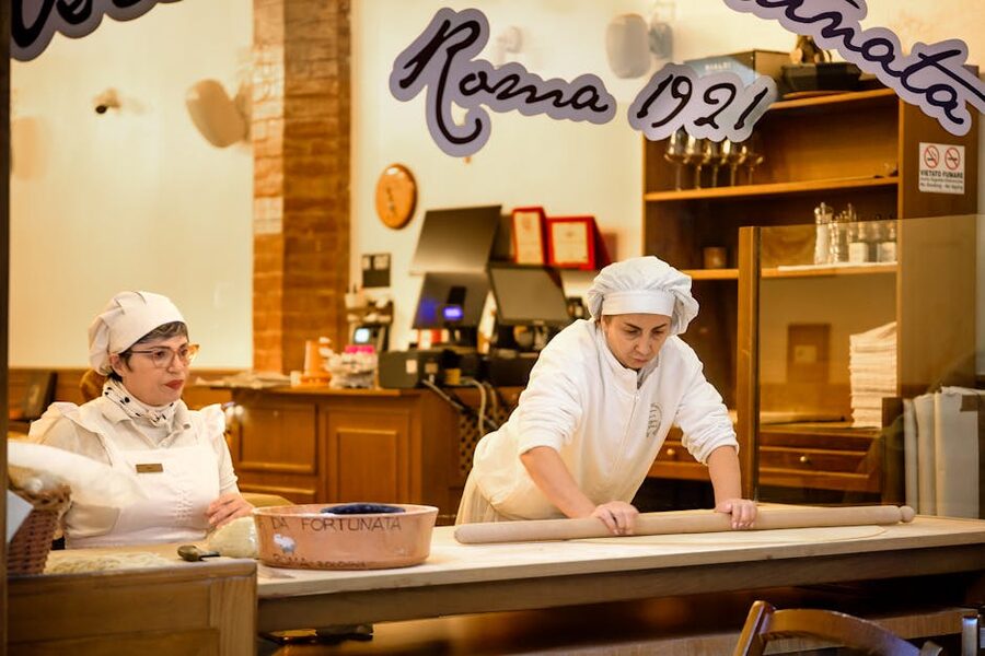 Italian chefs preparing fresh pasta together