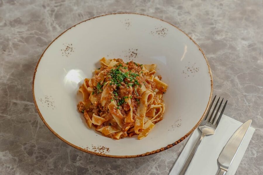 Italian pasta bolognese elegantly plated