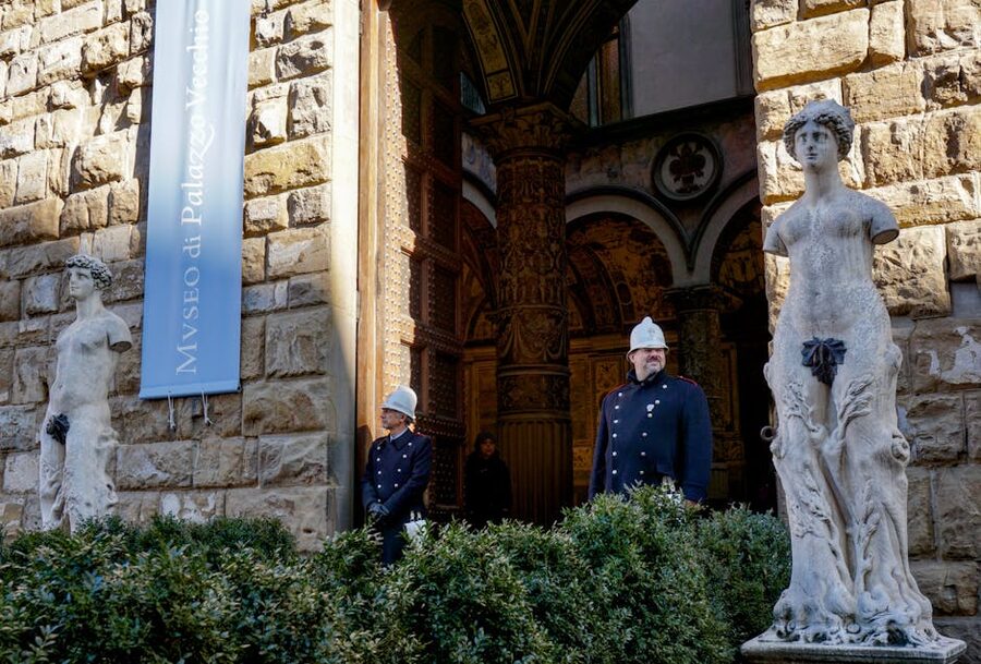 The entrance to the Palazzo Vecchio museum with statues