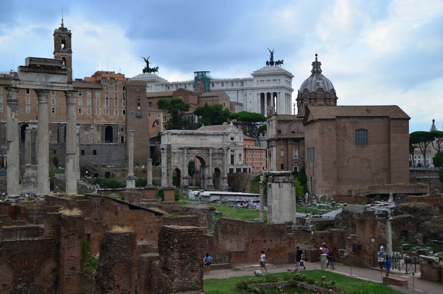 Ancient columns and ruins of the Roman Forum with historic landmarks