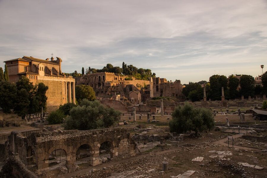 Ancient Roman Forum ruins bathed in golden sunset light