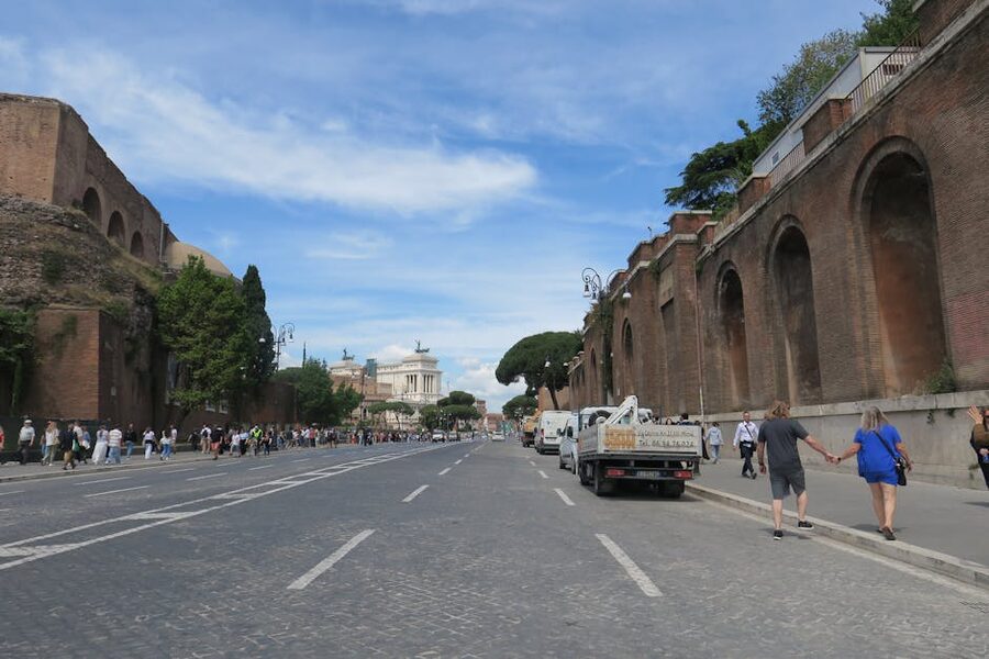 Street in Rome featuring ancient walls and historic buildings