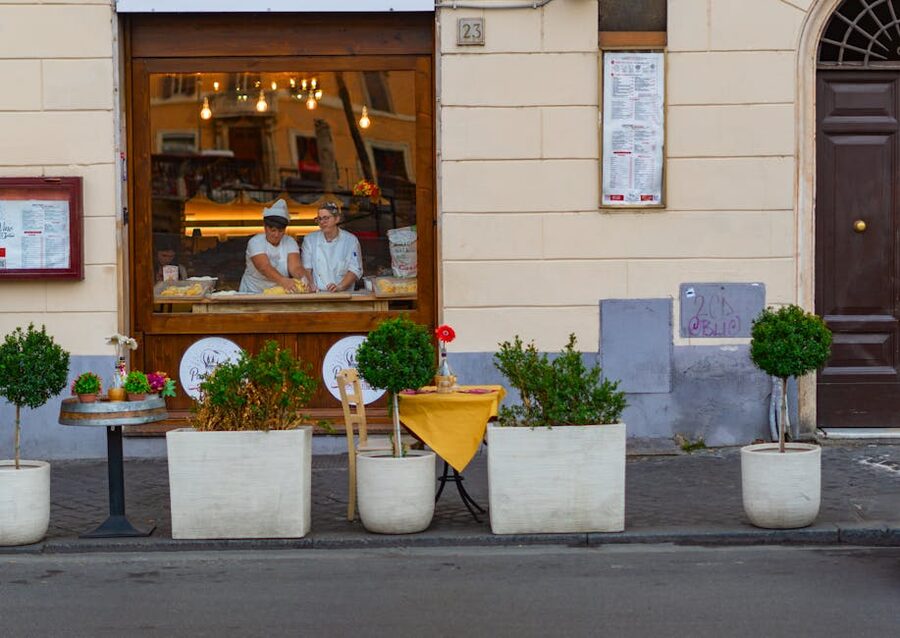 Italian bakery with chefs preparing food on a Rome street