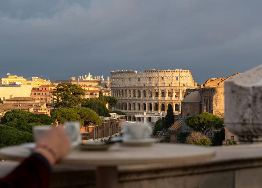 Breakfast at a Roman cafe with the Colosseum visible in the background