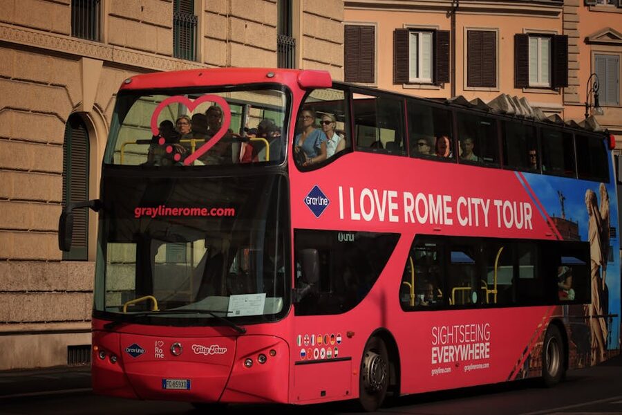 Double-decker hop-on hop-off sightseeing bus in Rome with tourists