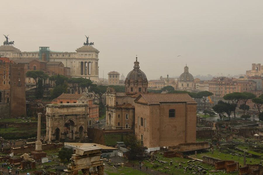 Historic Roman buildings and ruins under cloudy sky
