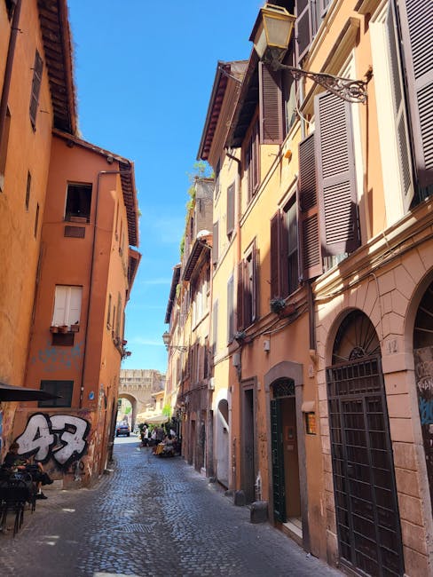 Narrow sunlit street in Trastevere with historic facades