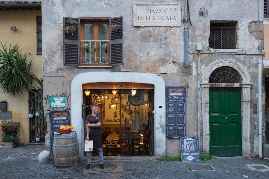 Rustic restaurant entrance in Trastevere neighborhood Rome