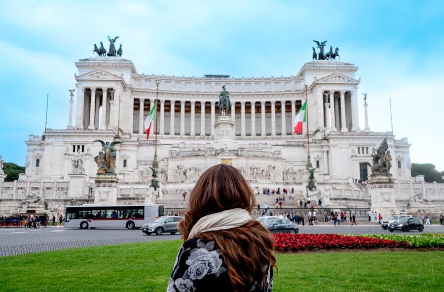 Woman standing before the Vittoriano monument in Rome