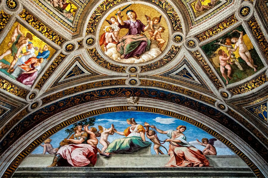 Ornate Renaissance frescoes and ceiling decorations on Sistine Chapel walls