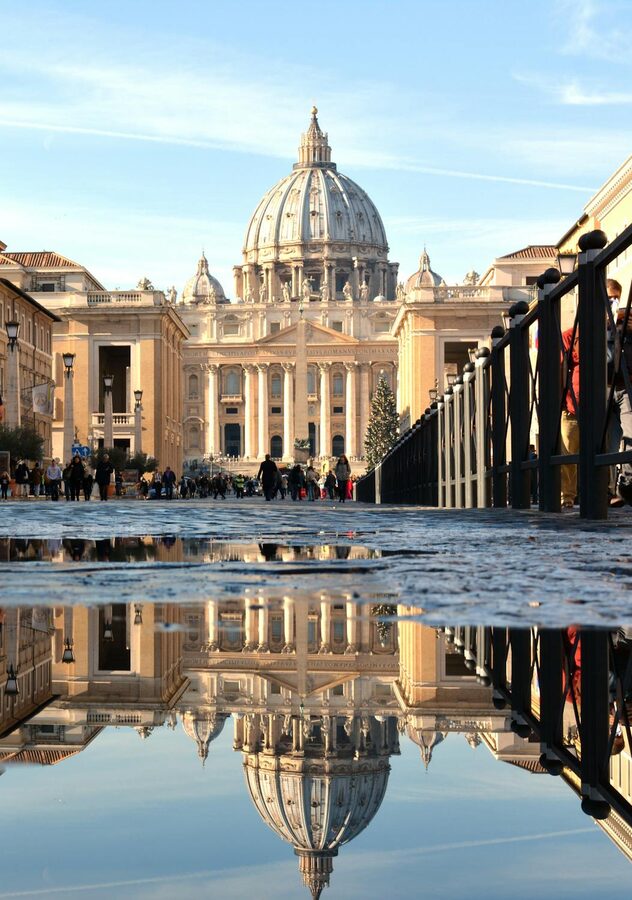 St Peters Basilica reflected in the Tiber River at twilight