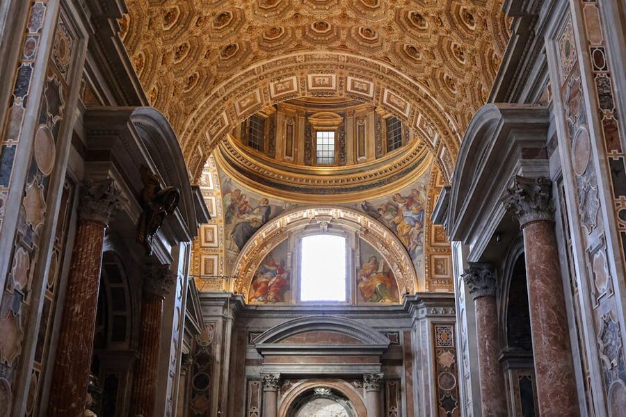 Wide view of St Peters Basilica interior showing the main nave
