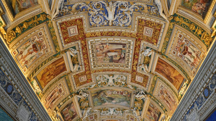 Ornate Renaissance ceiling fresco in a Vatican Museums corridor