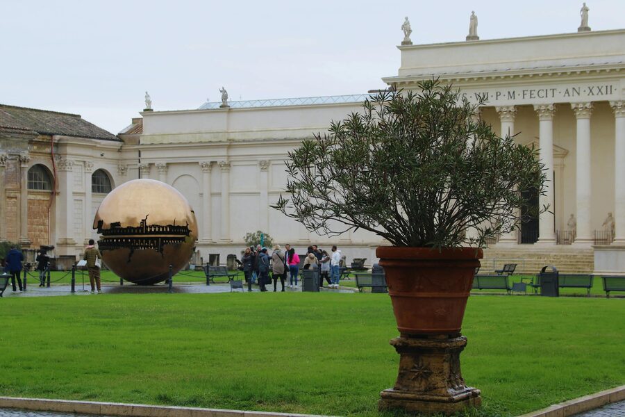 Sphere Within Sphere sculpture by Arnaldo Pomodoro in the Vatican Museums courtyard