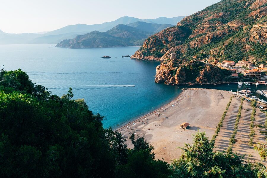 Corsica coast village with mountains and sunset