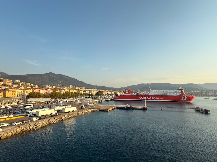 Ferry at Ajaccio port in Corsica with mountainous backdrop