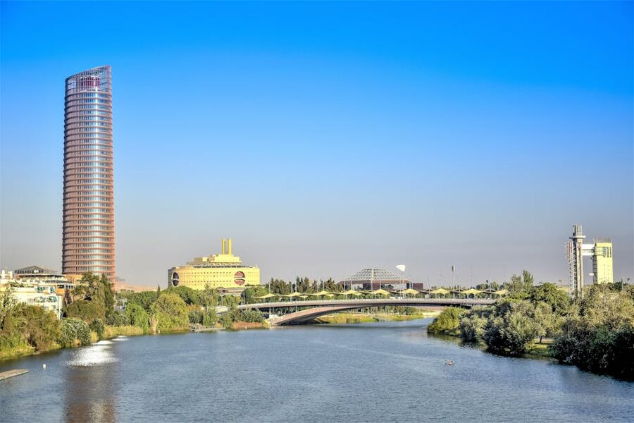 Alamillo bridge and Torre Sevilla skyscraper from the river