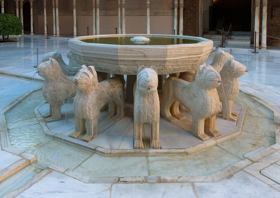 Patio de los Leones with twelve marble lions supporting the central fountain inside the Nasrid Palaces