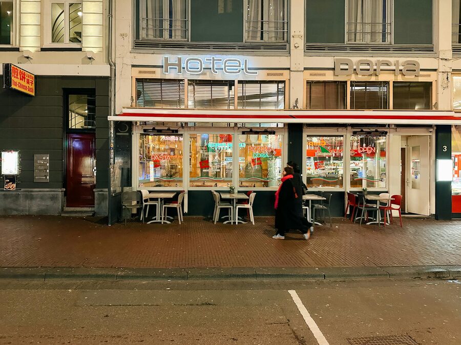 Illuminated bistro Amsterdam evening near De Wallen