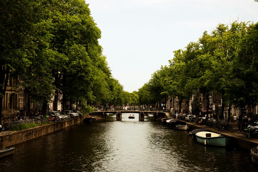 Amsterdam canal with tour boat