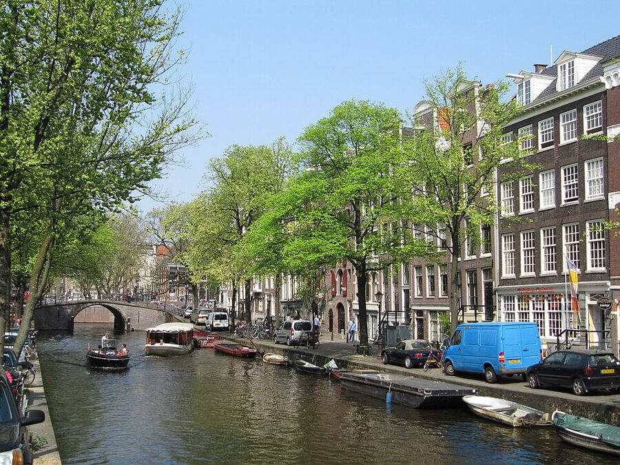 The Reguliersgracht canal in Amsterdam looking down a row of arched bridges