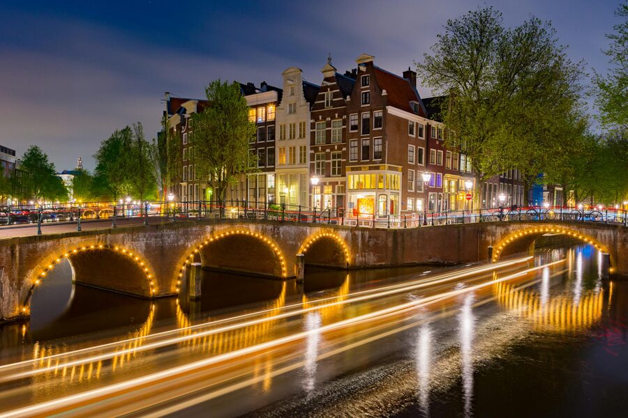 Long exposure of Amsterdam canal and historic buildings