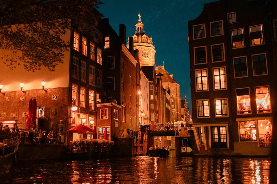 Amsterdam canals at night with historic architecture