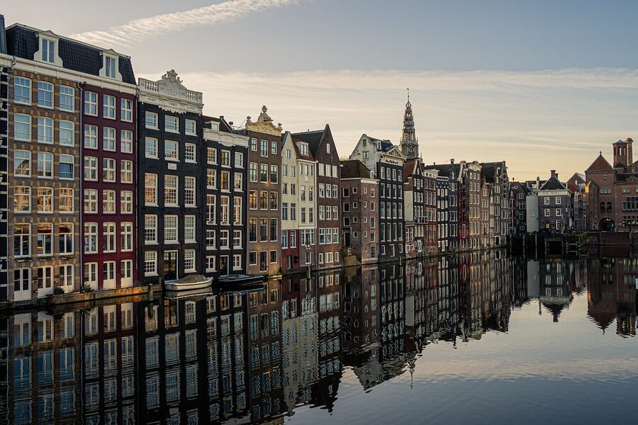 Amsterdam canal houses reflecting in the water