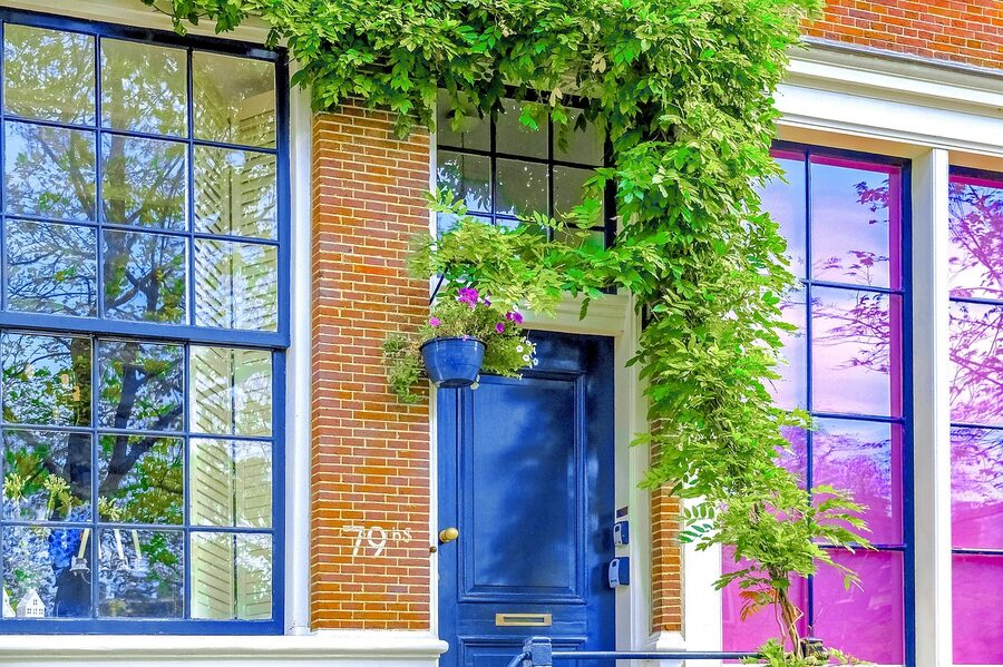 Jordaan blue door and brick facade Amsterdam