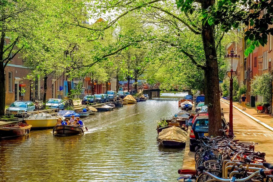 Family motor boat on a Jordaan canal Amsterdam