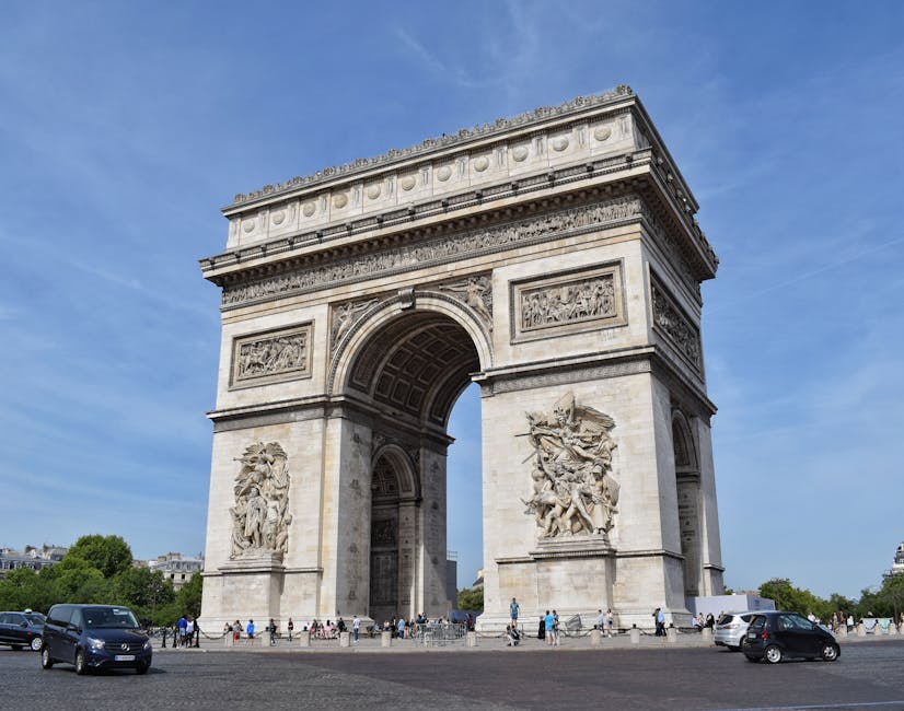 Tourists at base of Arc de Triomphe Paris