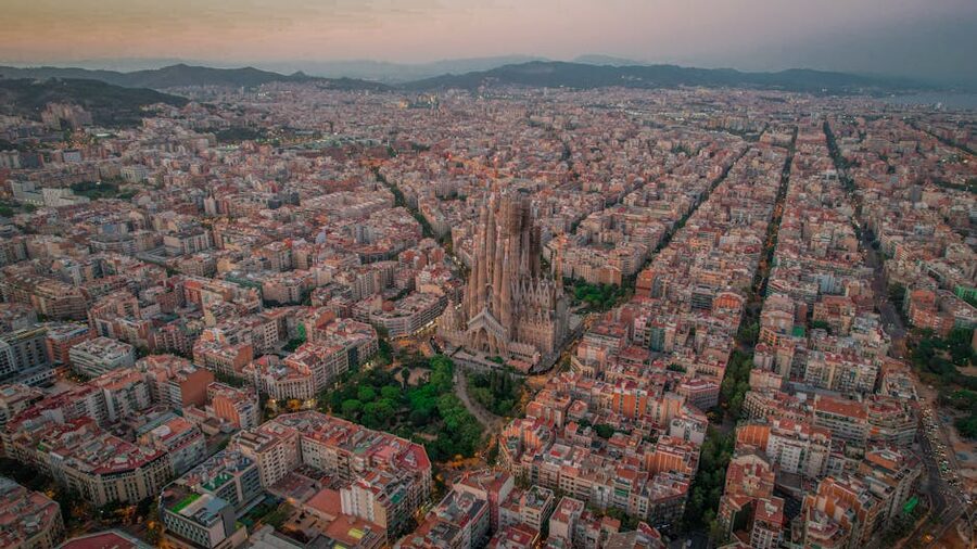 Aerial view of Barcelona at sunset with Sagrada Família visible