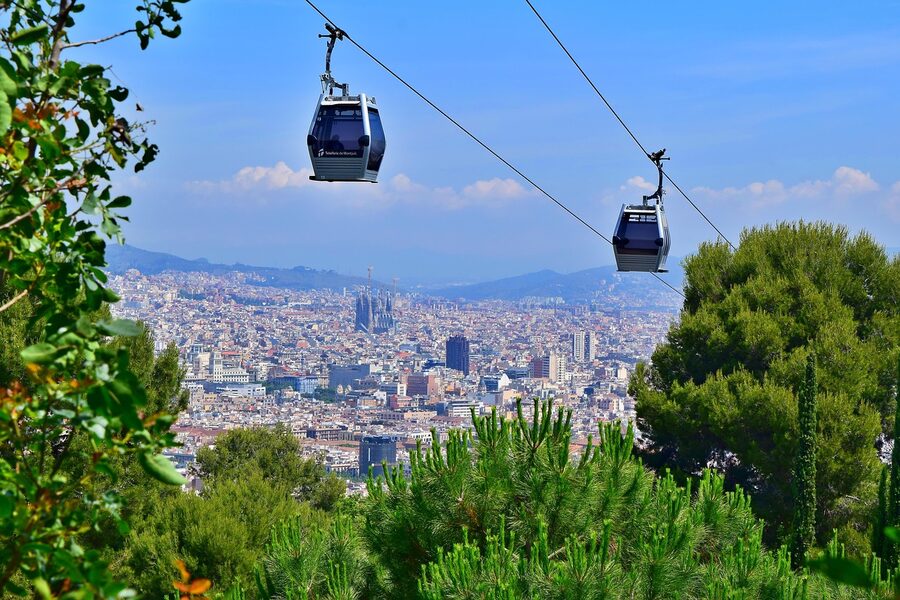 Montjuic cable car gondola with Sagrada Familia spires visible behind