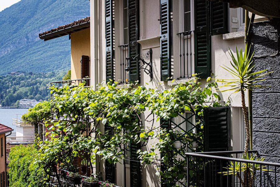 Window shutters and balcony with view over Lake Como Bellagio