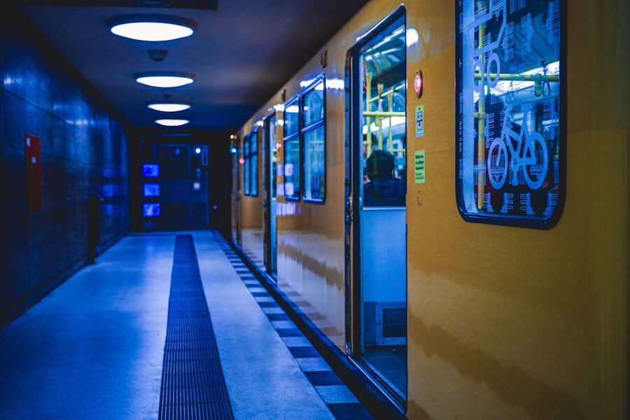 Berlin U-Bahn yellow train at a metro station at night