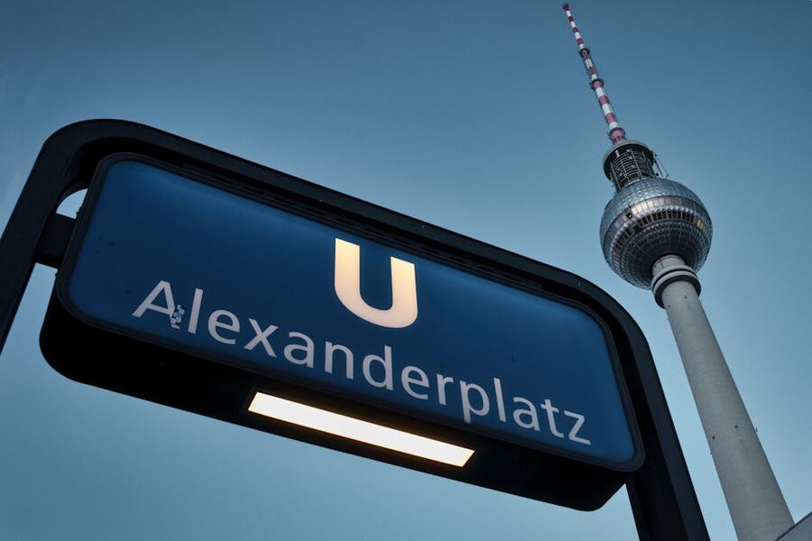 Alexanderplatz U-Bahn sign with Berlin TV Tower in background