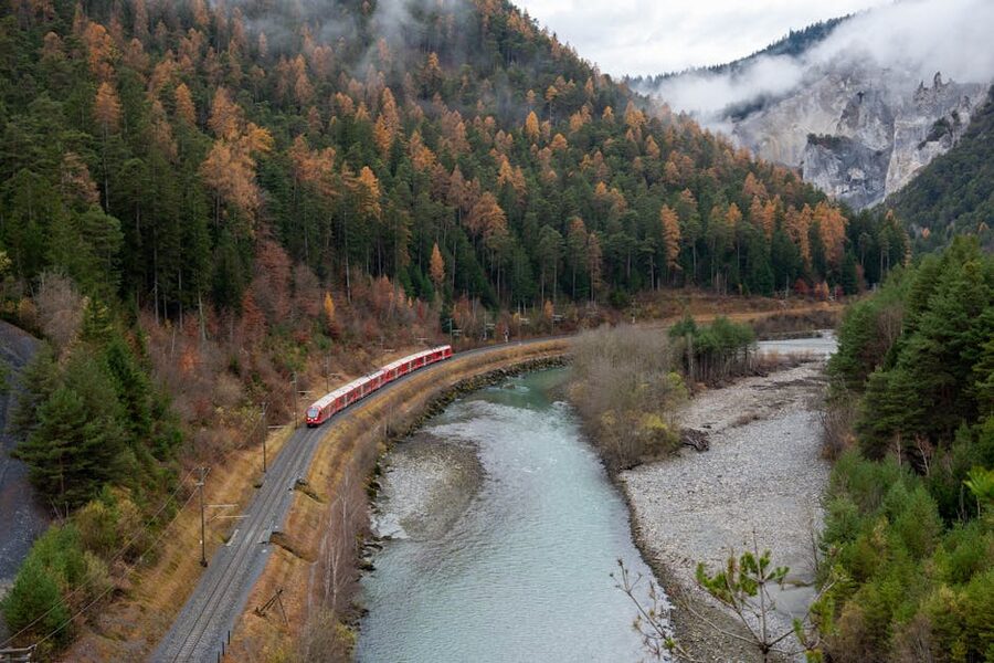Bernina Express through a Swiss canyon in autumn