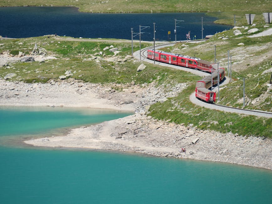 Red Bernina Express curving through the Bernina Pass