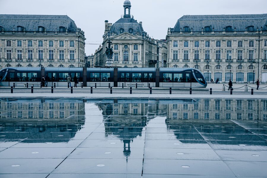 Bordeaux tram passing Place de la Bourse Miroir d Eau