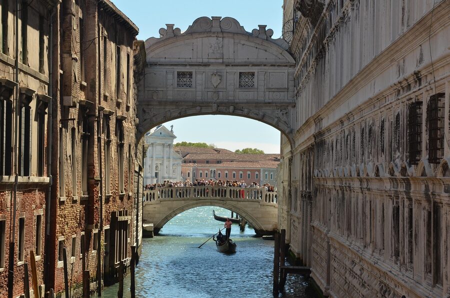 Bridge of Sighs with gondola passing underneath Venice
